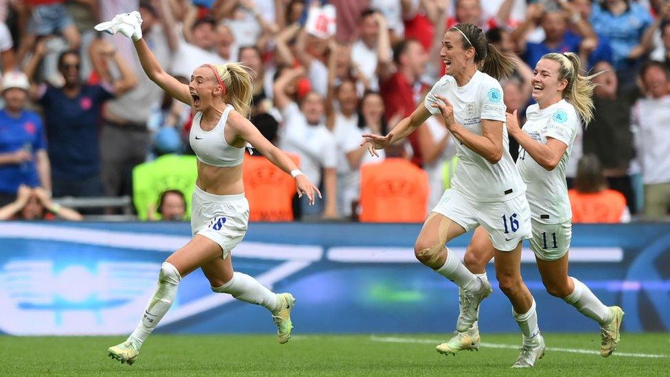 Chloe Kelly of England celebrates with team mates after scoring their side's second goal in extra time