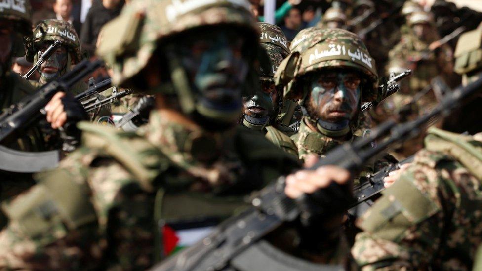 Palestinian Hamas militants take part in a rally marking the group's 30th anniversary in Gaza City (14 December 2017)