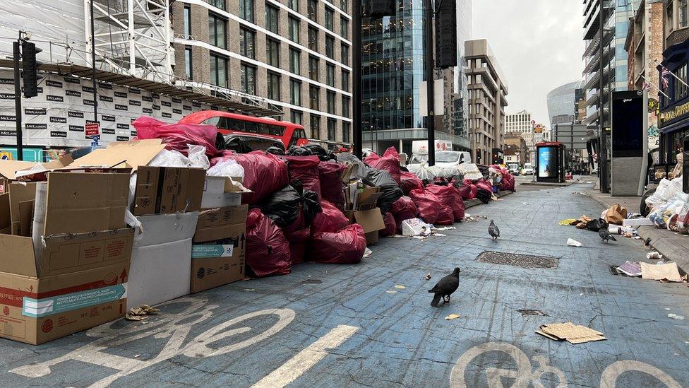 Rubbish piled along a street in Tower Hamlets