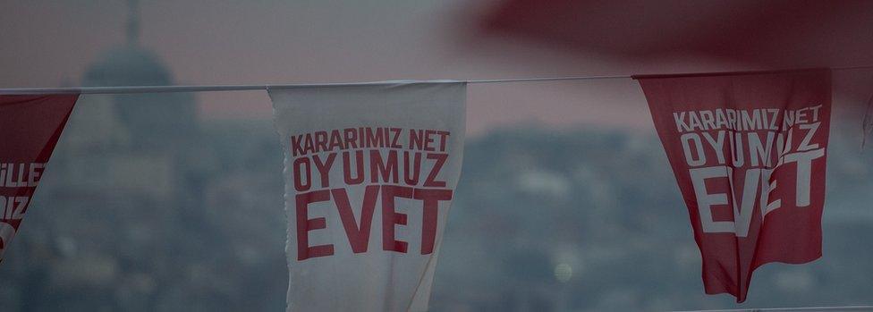 Flags supporting a Yes (Evet) vote in front of an Istanbul skyline