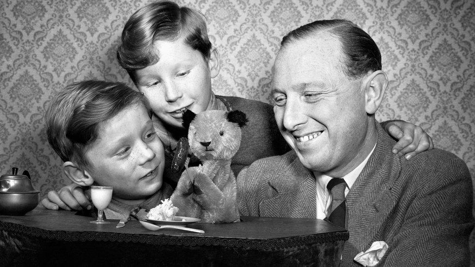 Harry Corbett with Sooty and sons David and Peter (also known as Matthew) in 1955