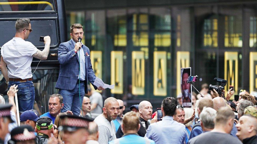 Robinson addresses supporters outside court