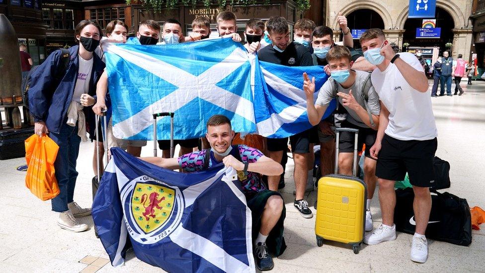 fans in Glasgow Central on Thursday