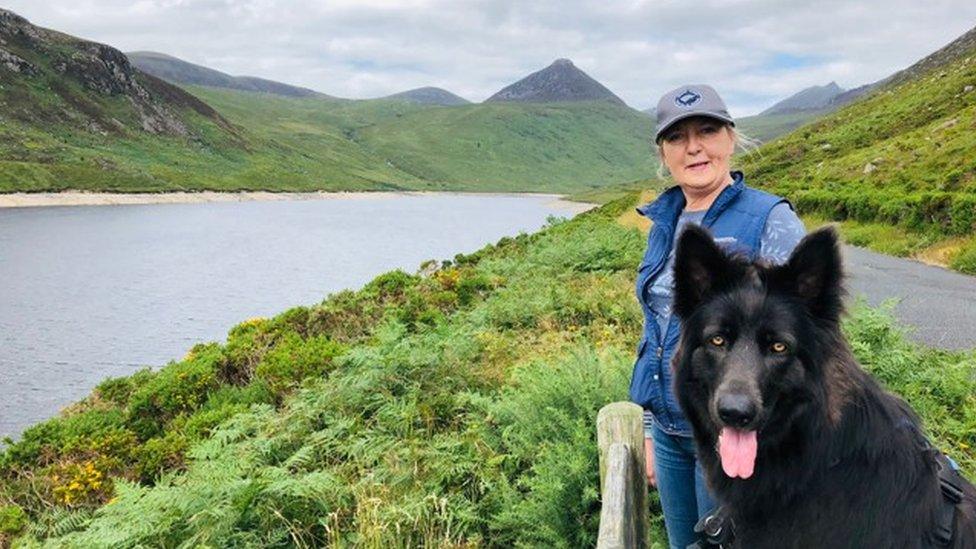 Sandra Gilliland and one of her dogs, Louie