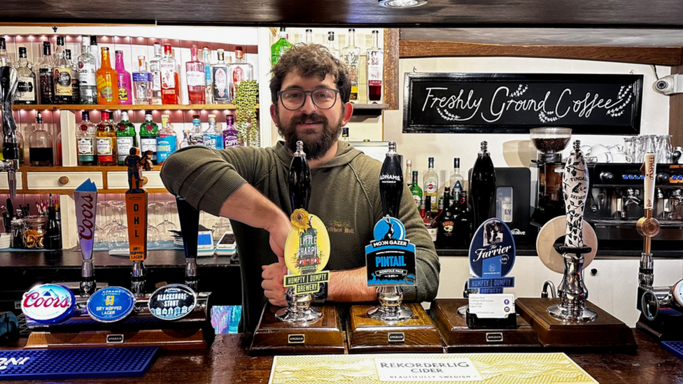 Harry Linden behind the bar