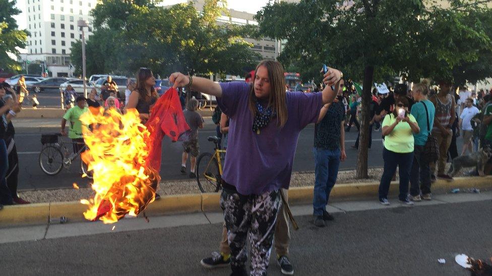 Protester burning t-shirt outside Trump rally in New Mexico