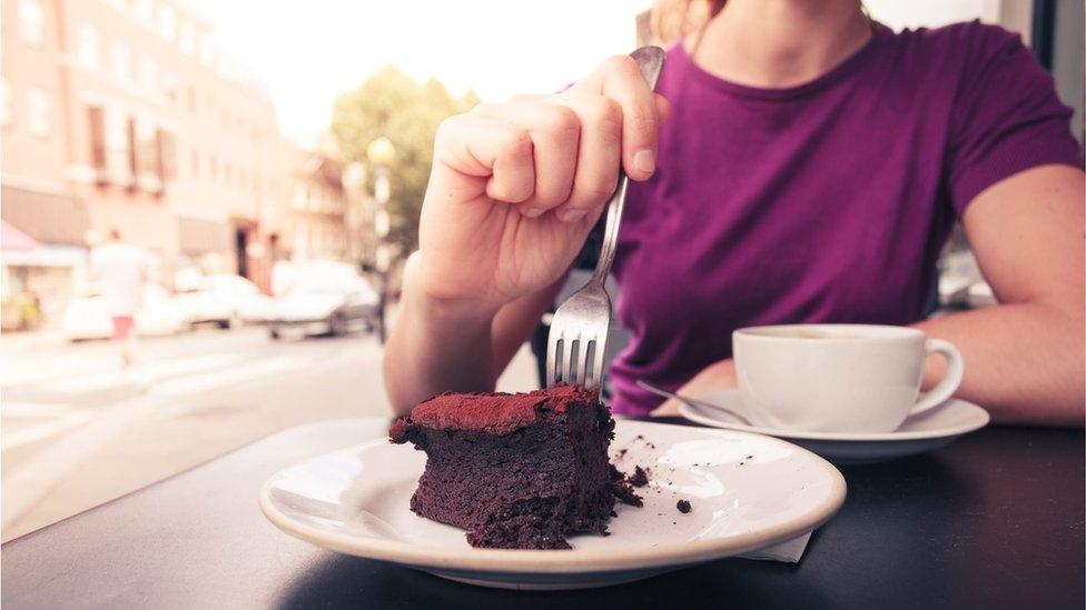 Woman eating cake