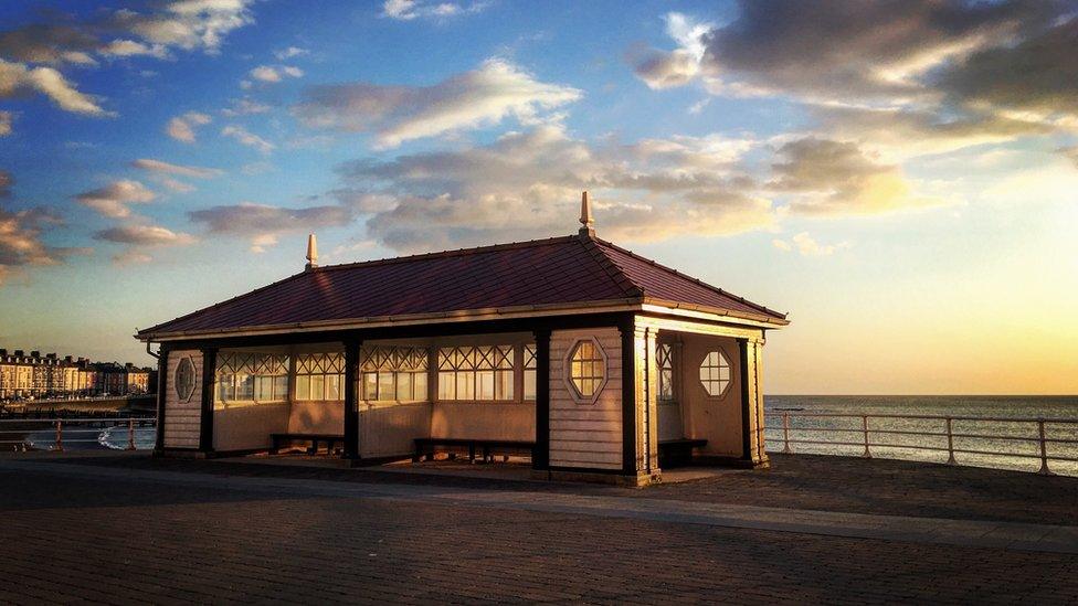 sun setting over Aberystwyth seafront