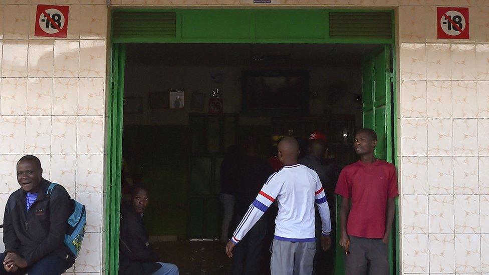 A man walks into a popular sports betting centre in Nairobi's Kawangware suburb - November 2017