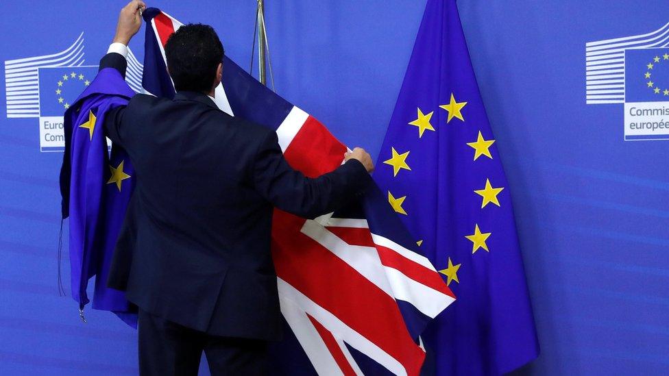 Flags are arranged at the EU Commission headquarters ahead of a first full round of talks on Brexit