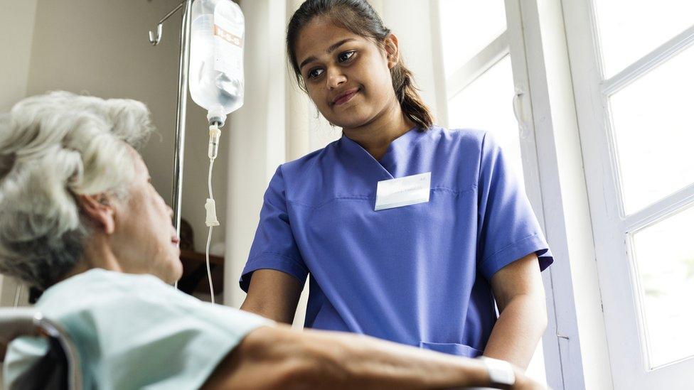 A nurse with an elderly patient