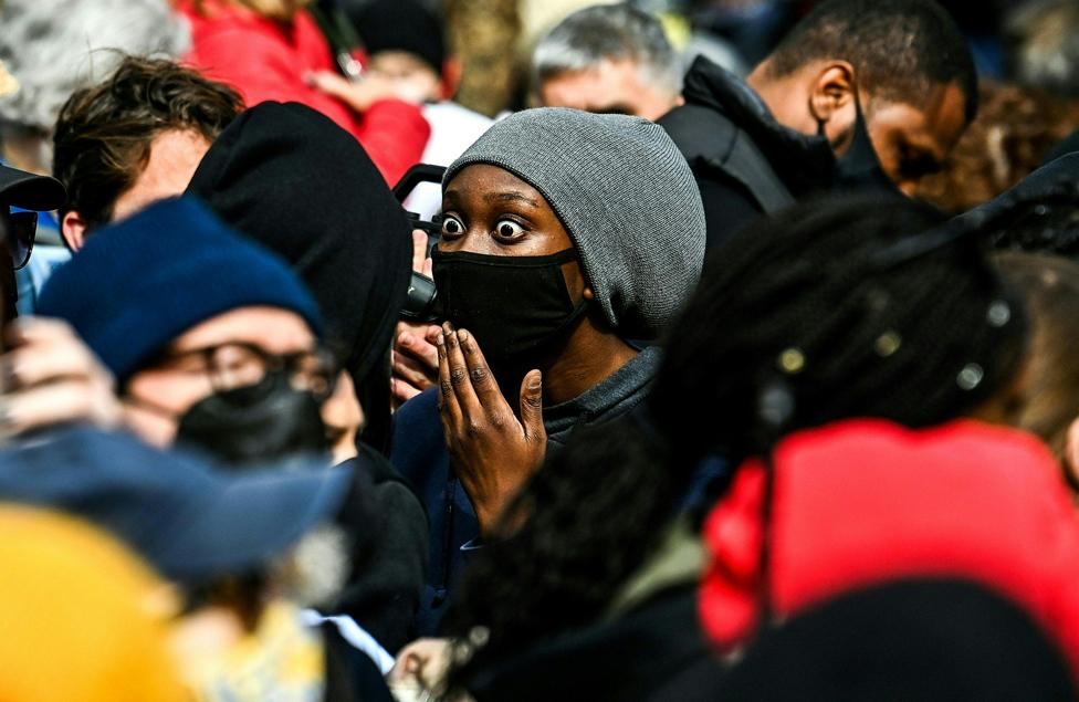 People react as the verdict is announced in the trial of former police officer Derek Chauvin outside the Hennepin County Government Center in Minneapolis, Minnesota on 20 April 2021