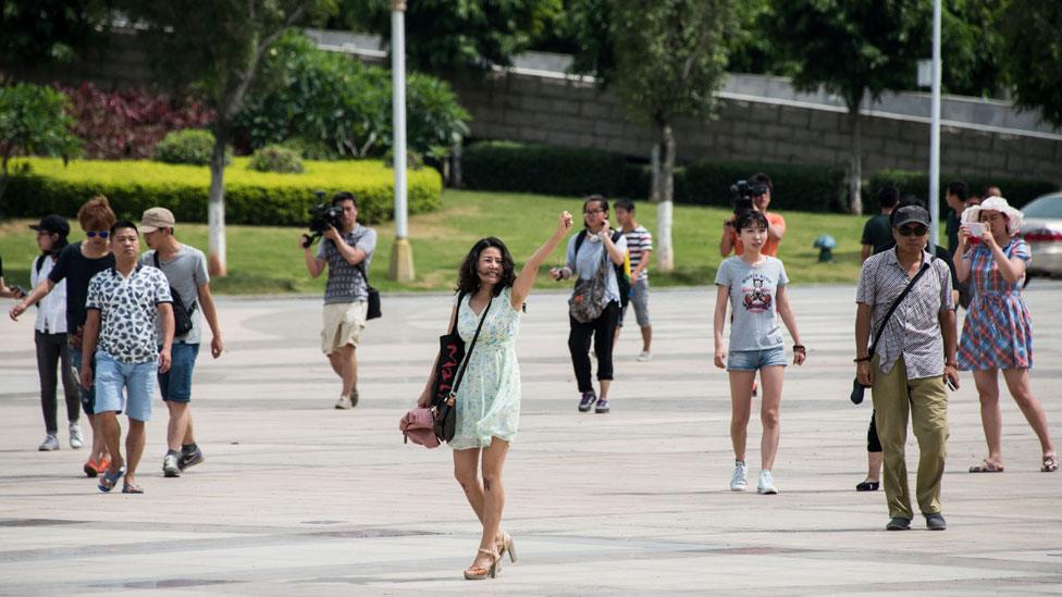 A protester shouts slogans condemning the slaughter of dogs at the Yulin festival