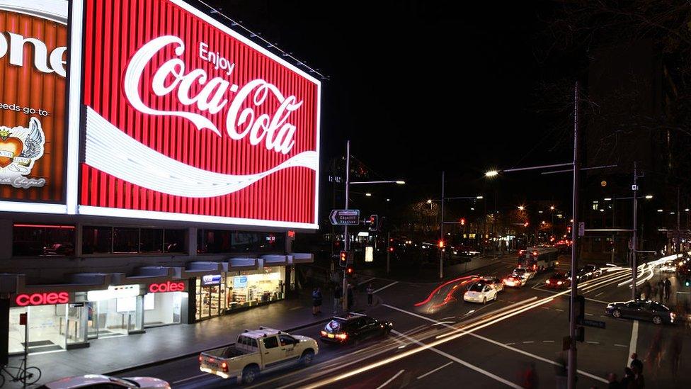 A famous neon "Coca-Cola" sign hangs over Sydney's Kings Cross suburb