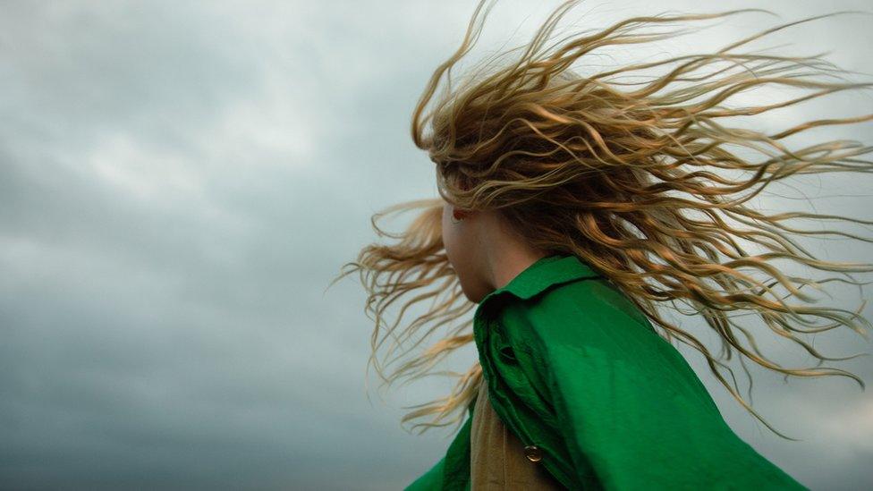 Girl with hair blowing in the wind