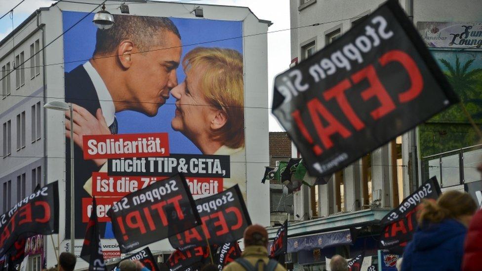 Protesters rallying against the TTIP and CETA free trade agreements march on the eve of President Obama's visit