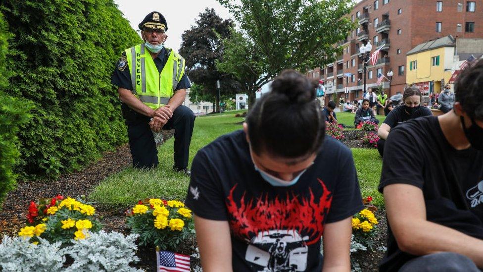 City of Revere Chief of Police joins others in taking a knee in front of Revere City Hall during a protest in support of George Floyd