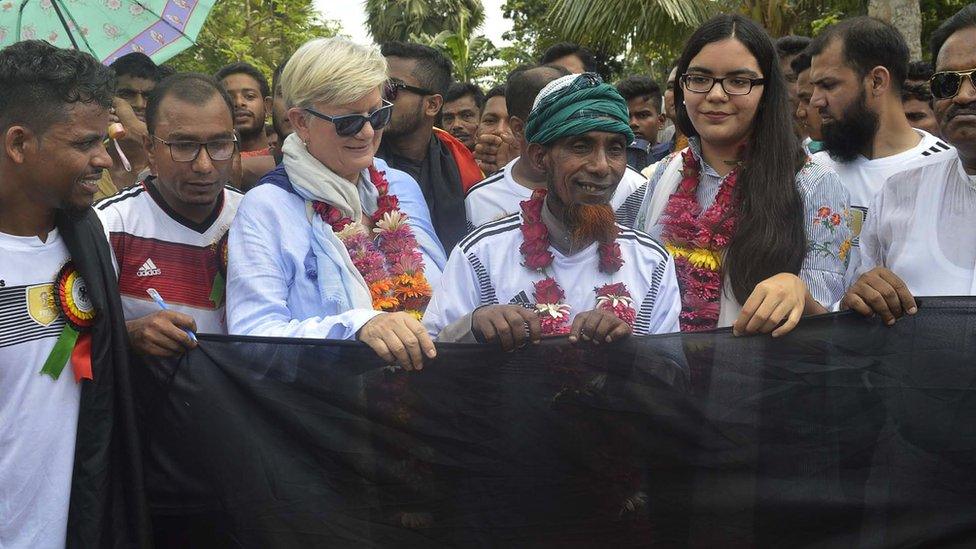 Farmer Amjad Hossain (C) pictured with his giant German flag in Magur, Bangladesh, 5 June 2018