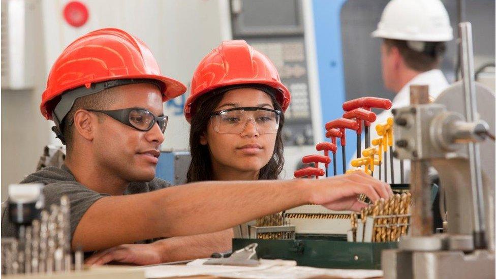 Apprentices with drill bits