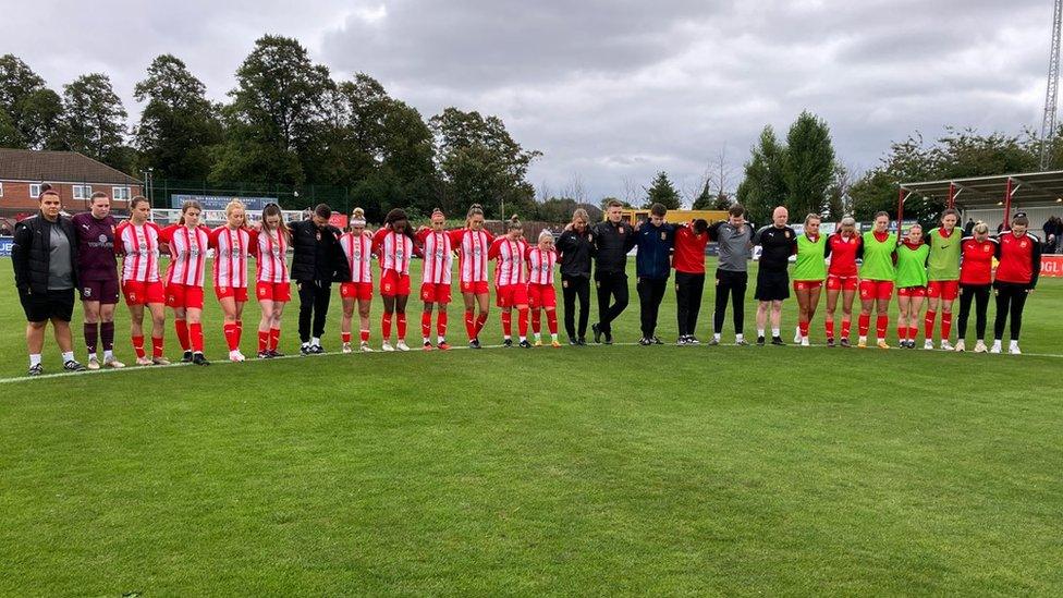 Players holding minute's silence