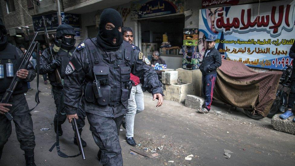 Members of Egyptian police special forces patrol streets in al-Haram district of Cairo on 25 January 2016