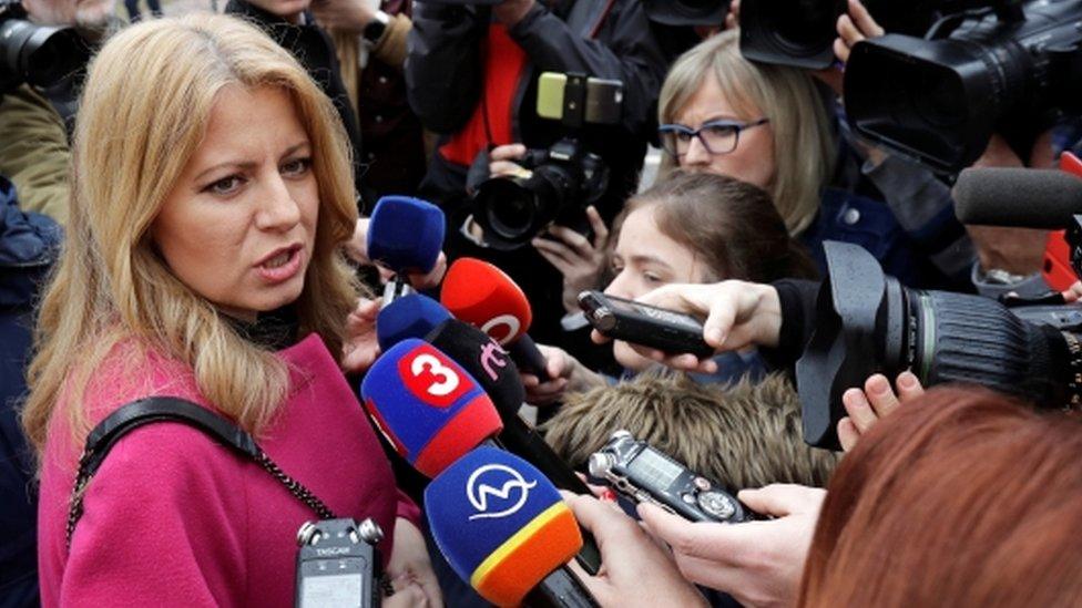 Slovakia presidential candidate Zuzana Caputova speaks to media as she arrives to cast her vote during the country's presidential elections at a polling station in Pezinok, Slovakia, March 16, 2019