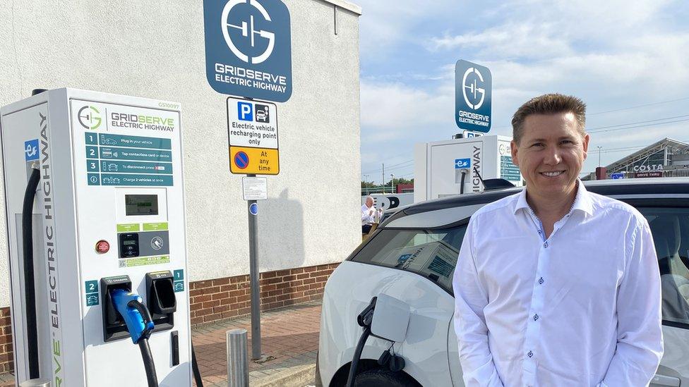 Toddington Harper is pictured next to upgraded charge points at Toddington services