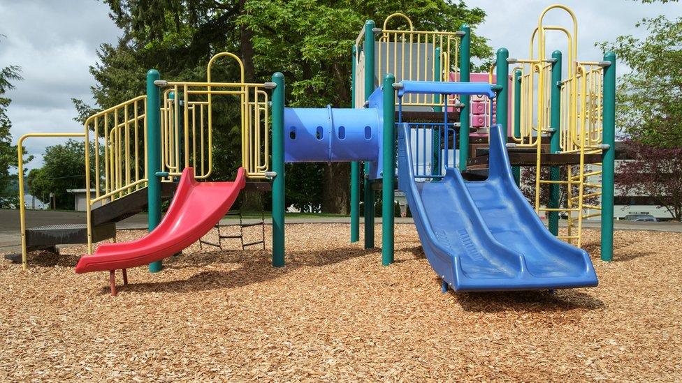 A playground with woodchip surface