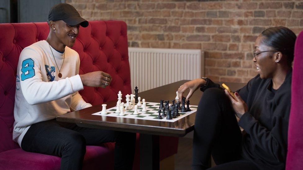 Charlton Takavarasha with a friend playing chess