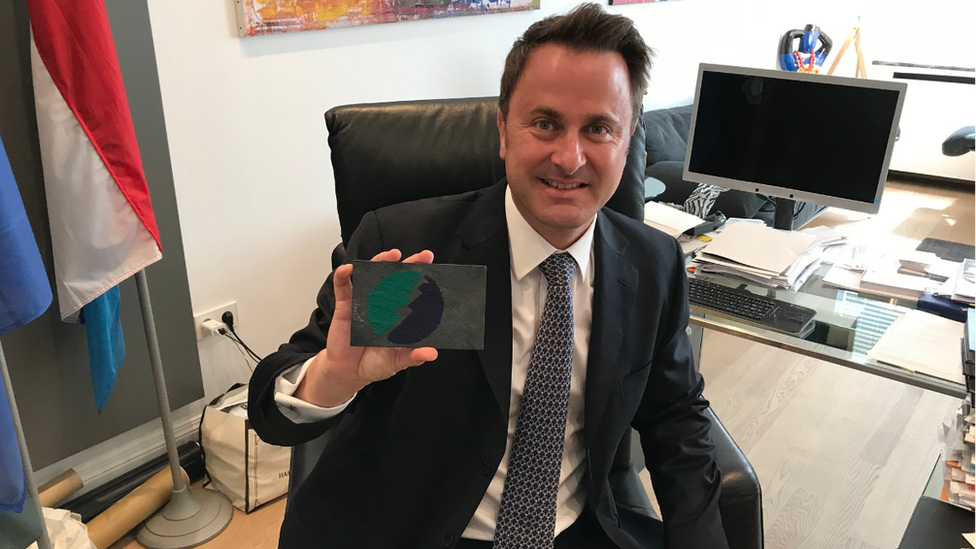 Luxembourg Prime Minister Xavier Bettel with the slate