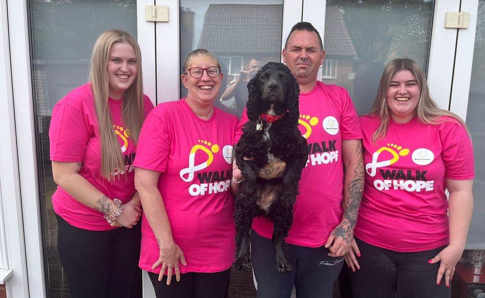 Jo Davies (second from left), pictured with Teigan, husband Mark, Evie and cocker spaniel Fern