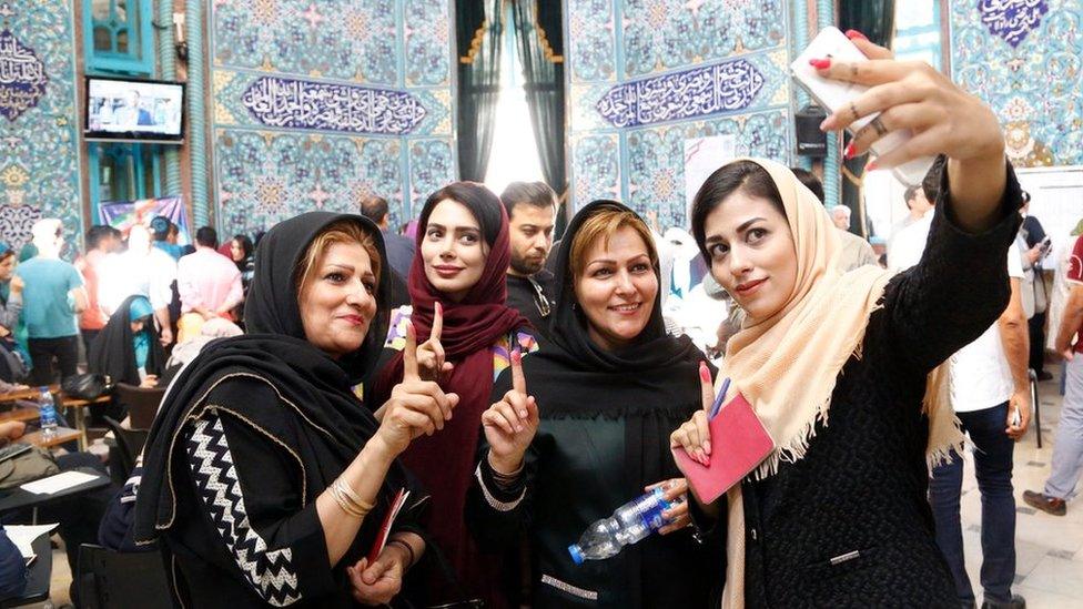 Iranians pose fo selfie photos after casting their ballots in the Iranian presidential elections at a polling station in Tehran, Iran, 19 May 2017