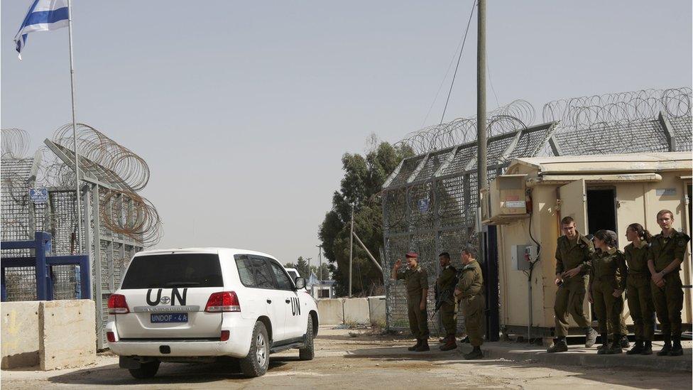 UN vehicle crosses into Israeli-occupied territory through the reopened Quneitra crossing in the Golan Heights on 15 October 2018