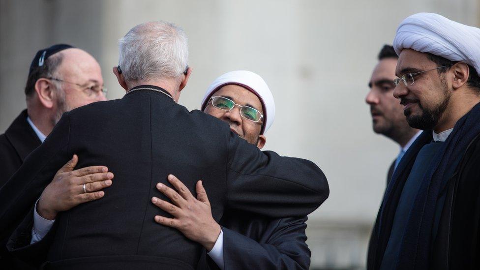 Archbishop of Canterbury, Justin Welby, embracing Sheikh Khalifa Ezzat, chief Imam and head of religious affairs at the London Central Mosque.