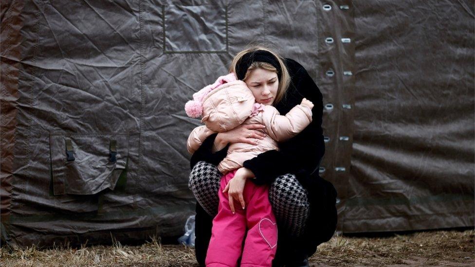 A mother and child at a refugee camp in Przemysl, Poland