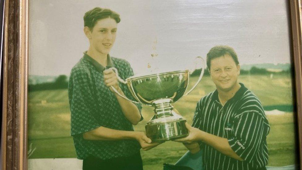 James with a golf trophy