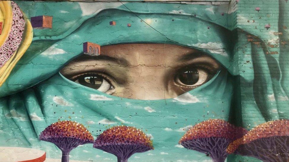 A mural of a Muslim girl in Hamtramck