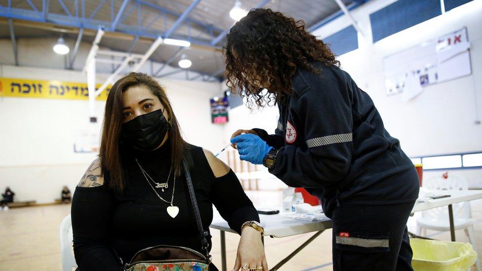 A woman in Tel-Aviv is vaccinated