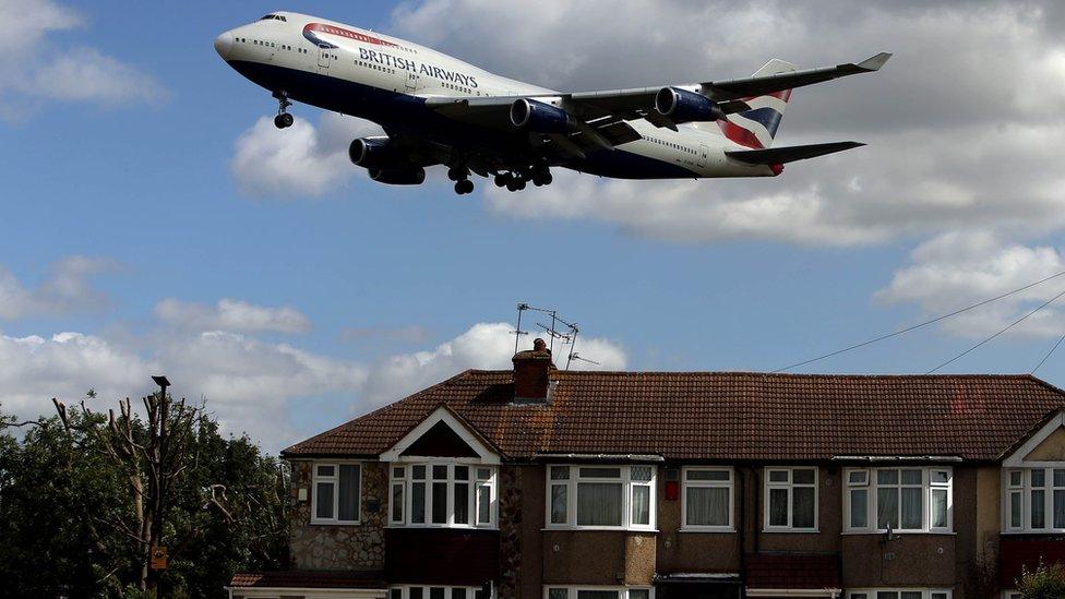 Plane over house