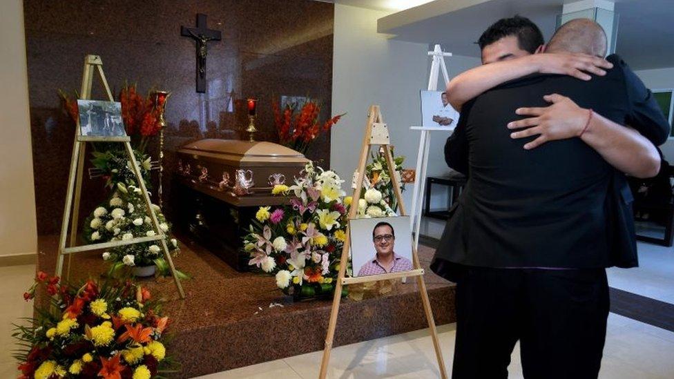 Relatives of Mexican journalist Hector Gonzalez Antonio, who was found beaten to death in Tamaulipas state, hug during his wake in Mexico City. Photo: 31 May 2018