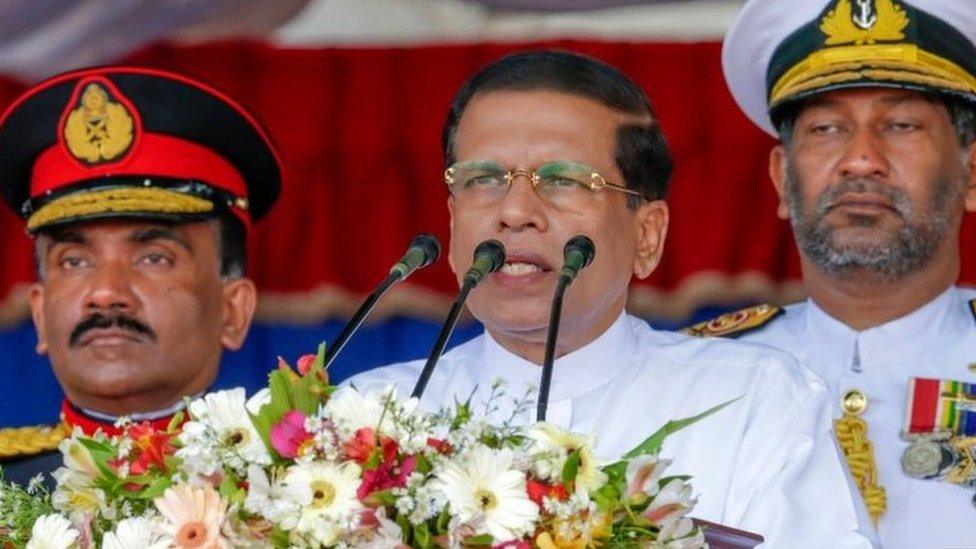 Sri Lankan President Maithripala Sirisena (C) speaks during a Victory Day parade in Matara.