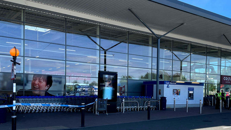 Police tape was placed across the front of the Tesco store in Dalmarnock