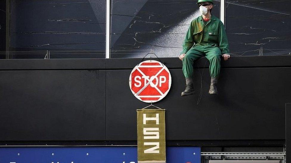 Protestor outside Euston underground station in central London