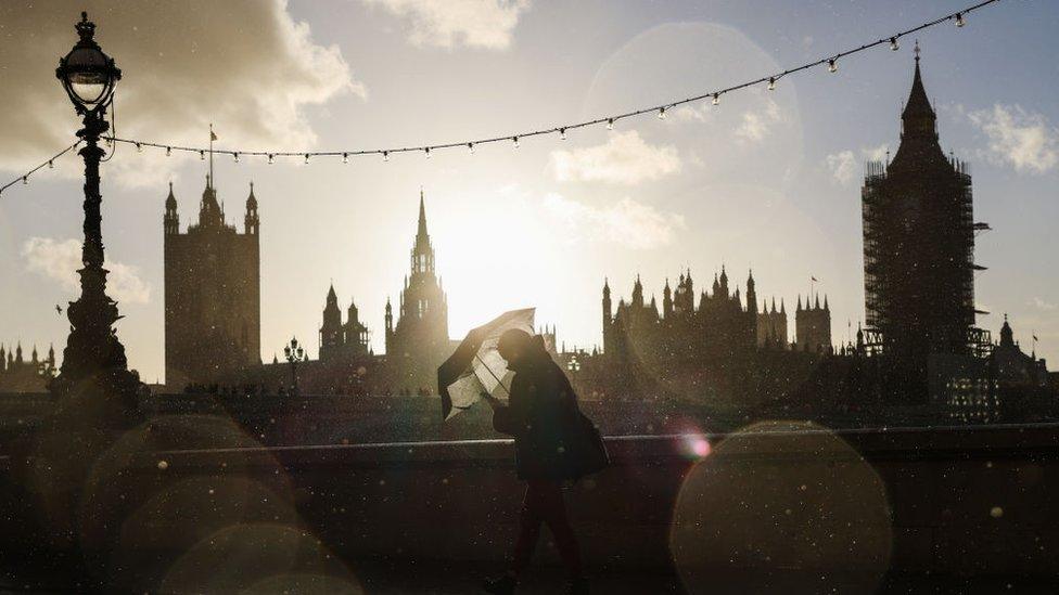 Woman walking near Parliament