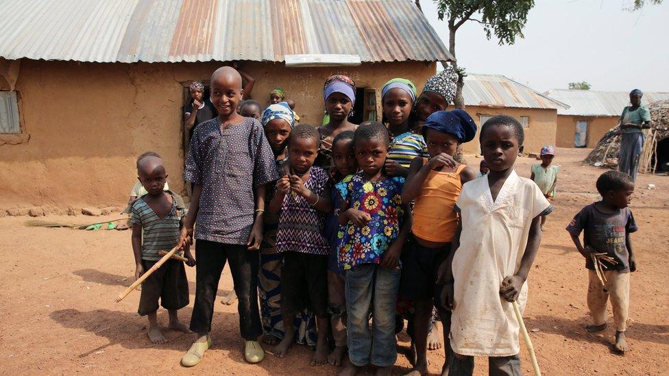 Children displaced by fighting in southern Kaduna, Nigeria in front a house where they took refuge.