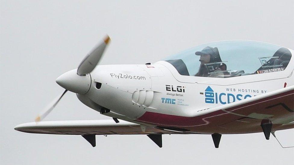 Zara Rutherford in the cockpit of her airborne plane