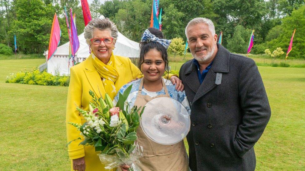 Great British Bake Off 2022 winner Syabira Yusoff with judges Paul Hollywood and Prue Leith