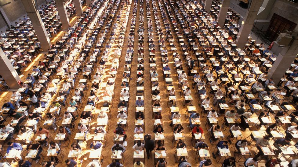 University students at exam hall, Royal Horticultural Hall, London