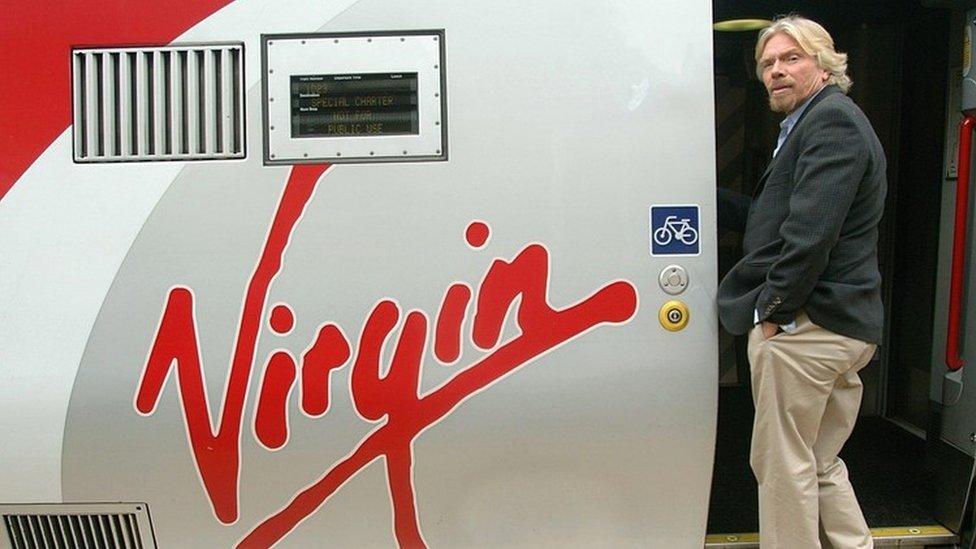 Richard Branson boards a Virgin train