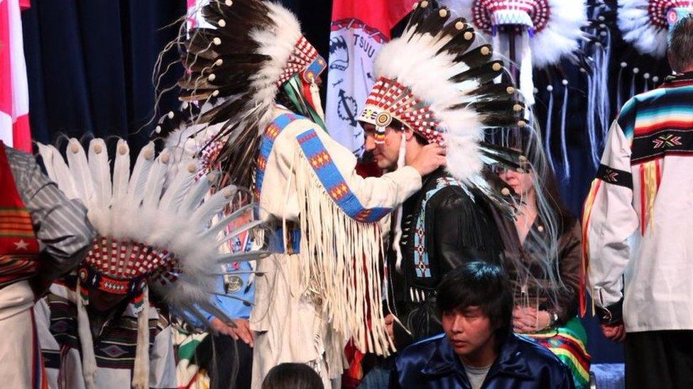 Justin Trudeau accepting a native Canadian headdress